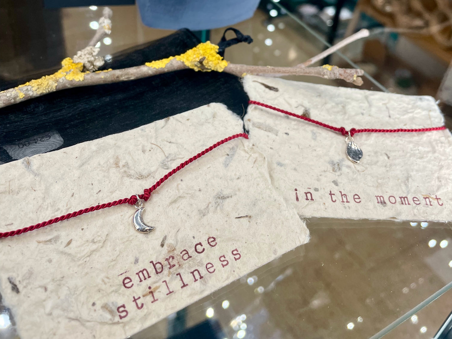 Handmade red silk string bracelet with silver leaf charm, crafted in Ireland, symbol of luck and love
Handmade red silk bracelet with silver bird charm, artisanal Irish jewellery